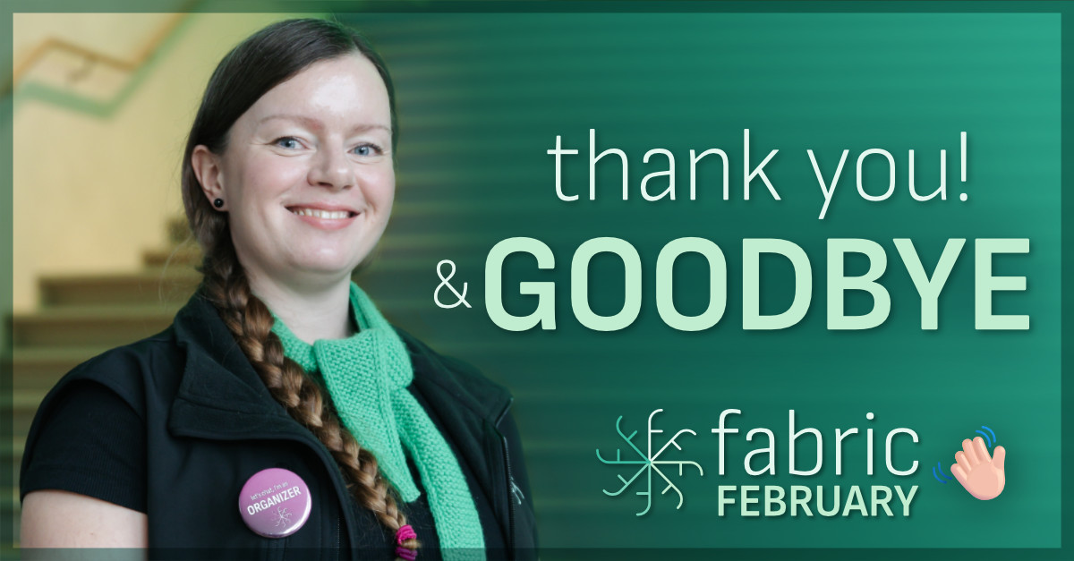 Close-up of Cathrine wearing a Fabric February scarf and pink organizer button.